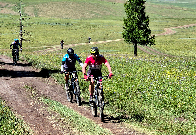 Cycle climbing up to the Mongolian hill